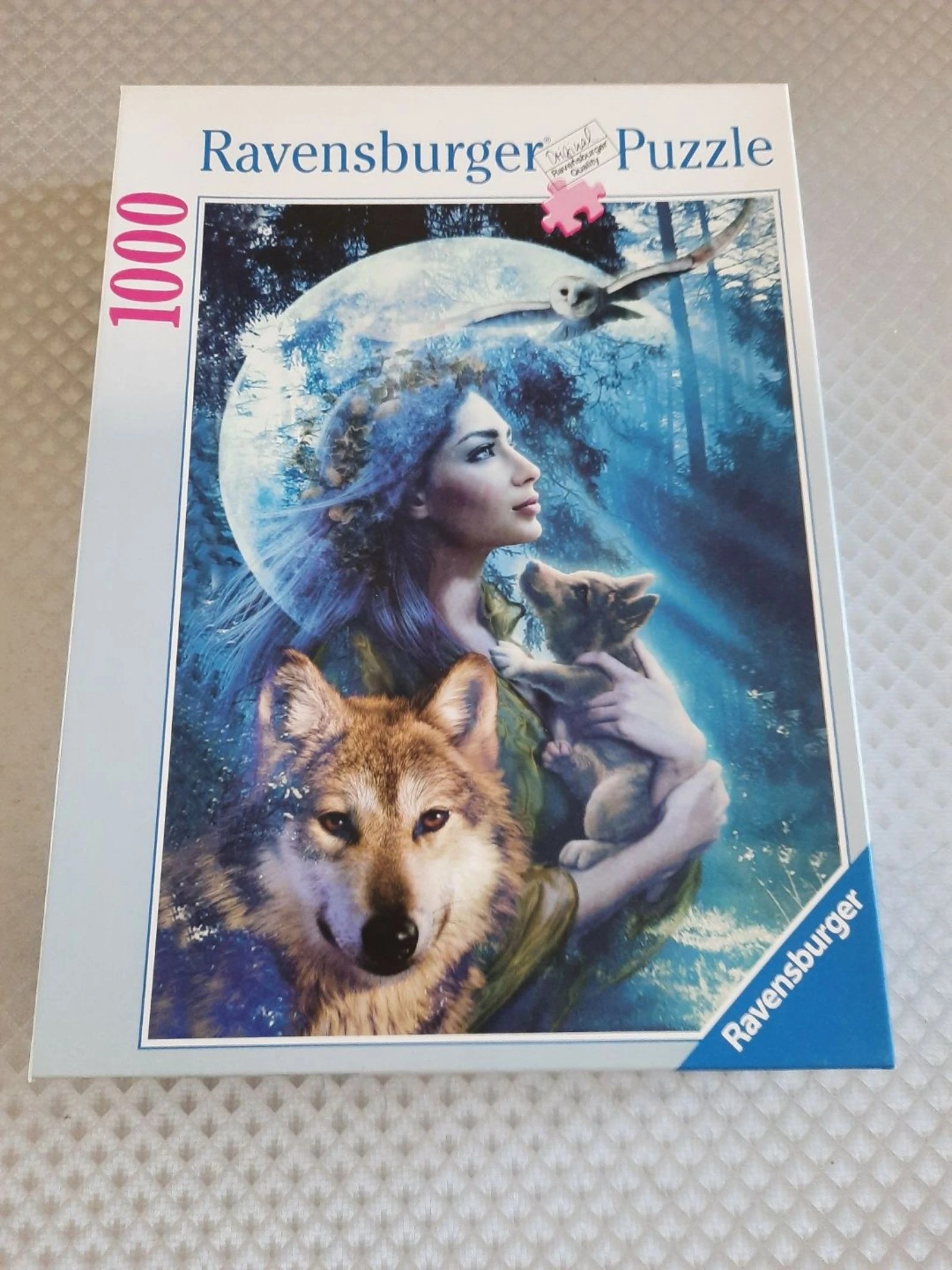 Puzzle Ravensburger 1000 pièces – Femme et loups – Complet